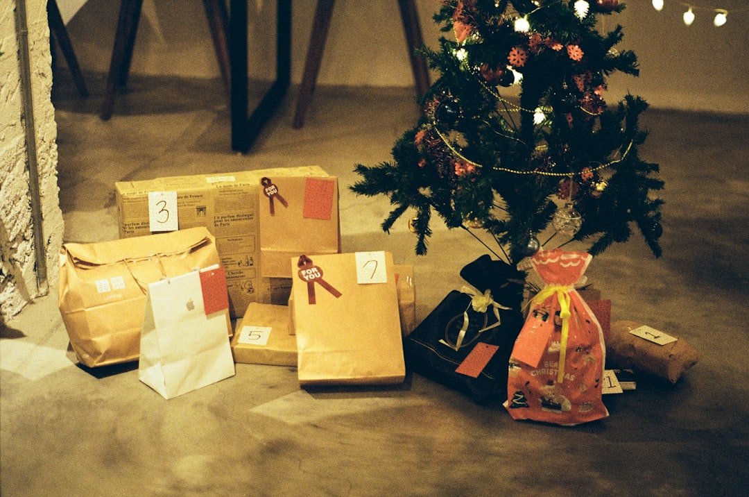 Holiday gift boxes with return labels and shopping bags from various retailers